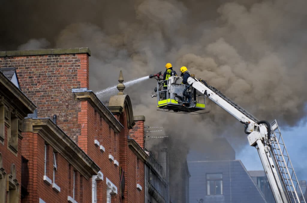 Firefighters putting out a building fire