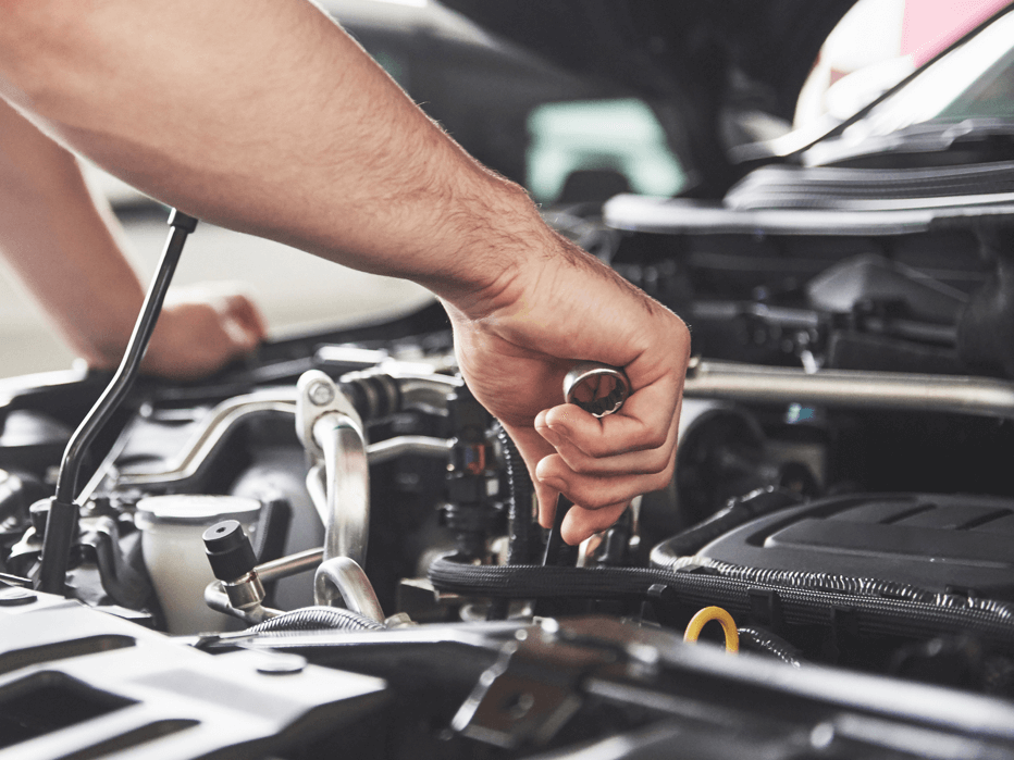 Mechanic fixing a car.