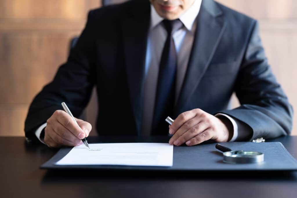 Lawyer signing documents