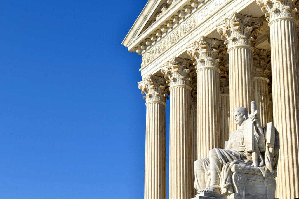 Guardian of Law seated marble figure outside the Supreme Court of the United States.