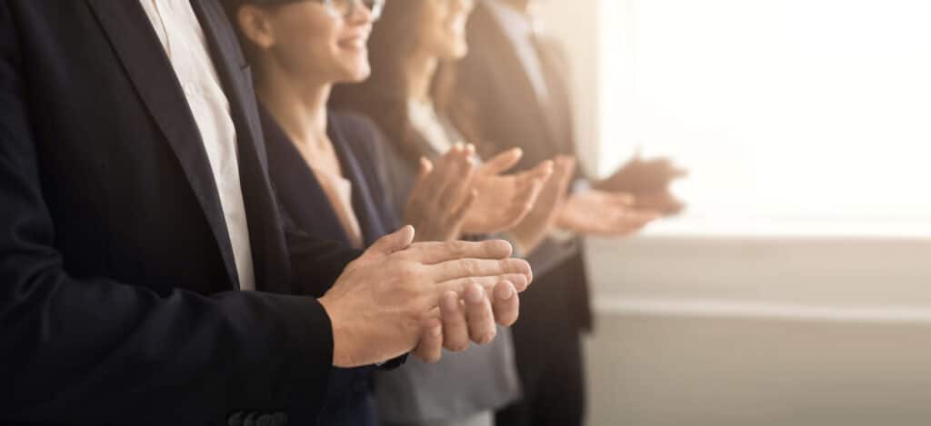 Closeup of business people clapping
