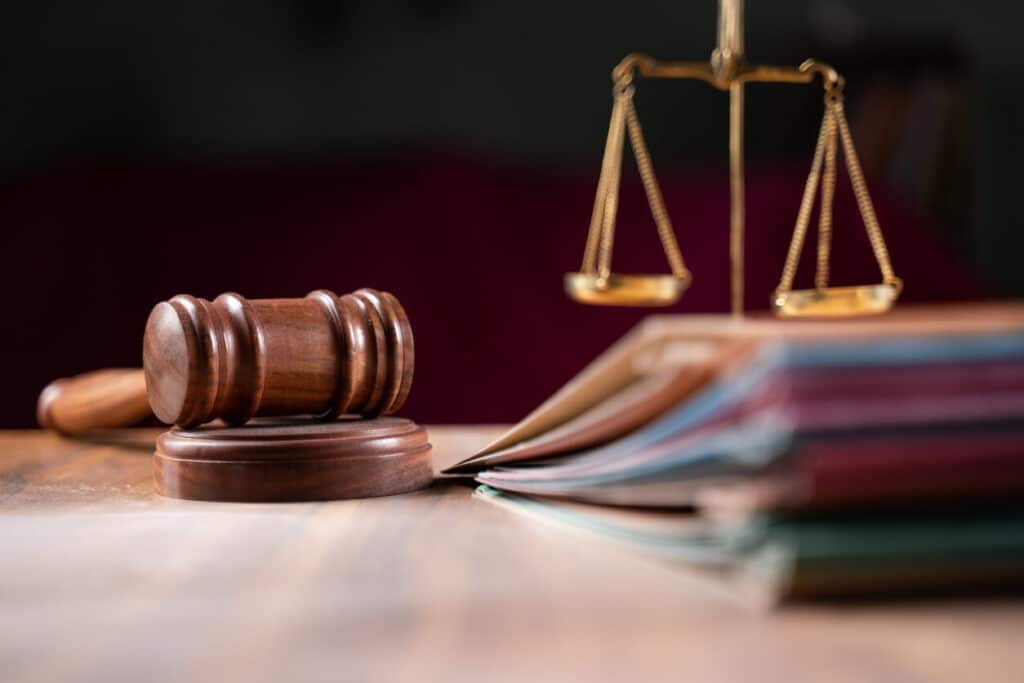 Gavel and files on a table.