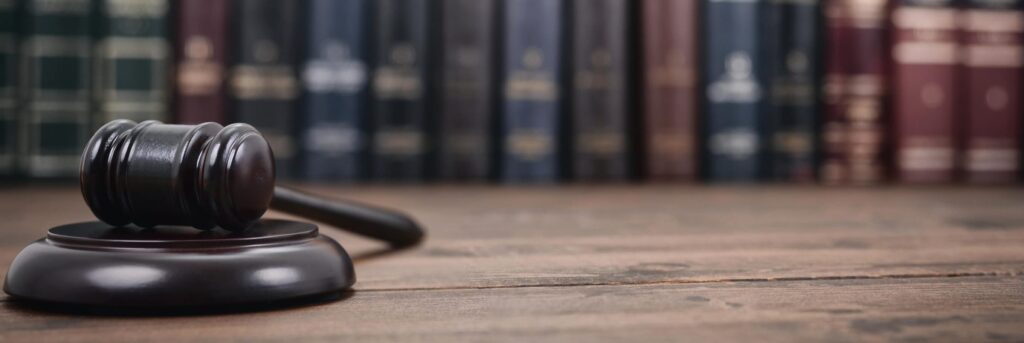 Gavel next to book shelf