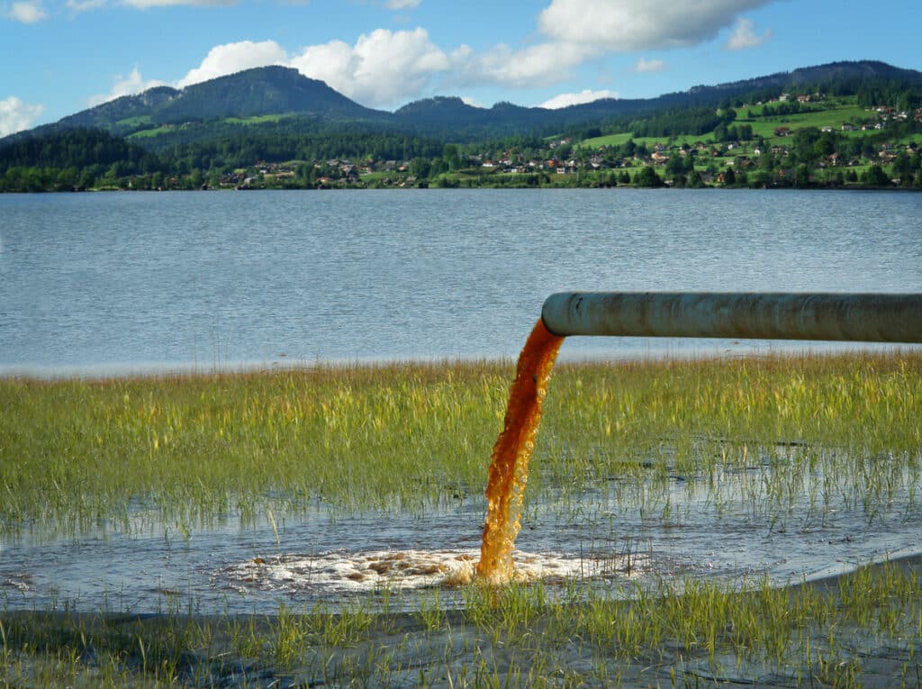 Dirty water being drained into a lake