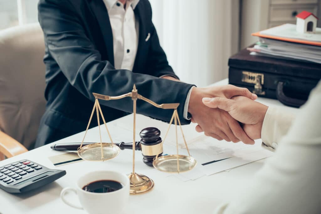 Lawyer shaking hands with a client