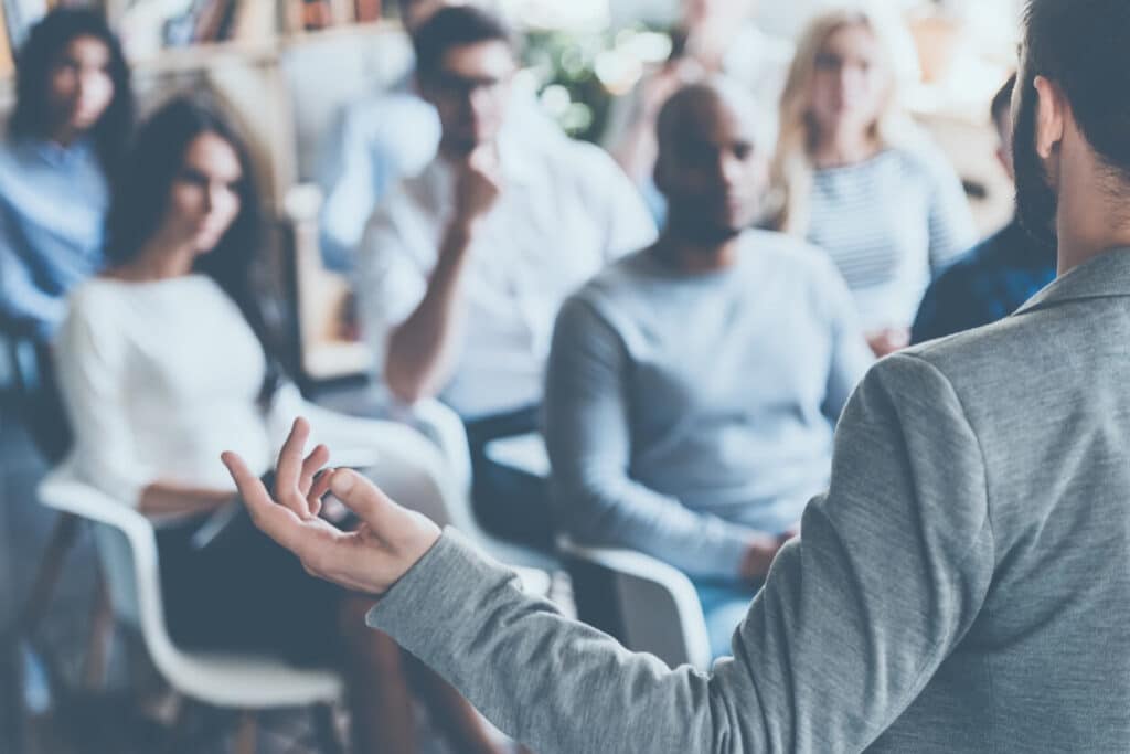 man speaking at seminar