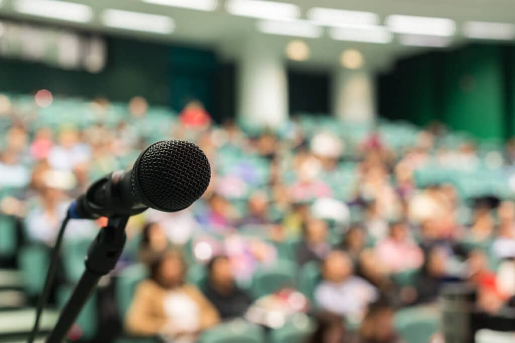 Close-up of a microphone at a college conference.