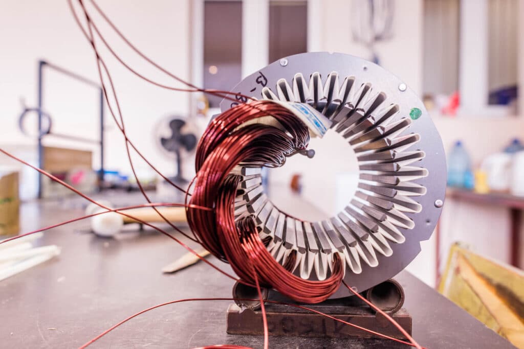 Electric motor being built in a factory.